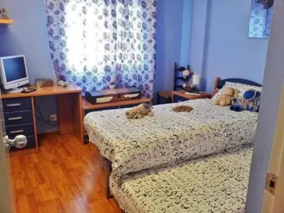 Cama o camas de una habitación en Piso Palomar