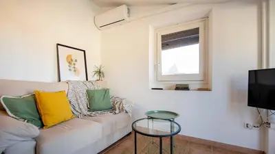 Una televisión o centro de entretenimiento en Romantic Duplex with terrace and great views