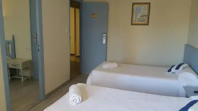 Cama o camas de una habitación en Hotel del Mar