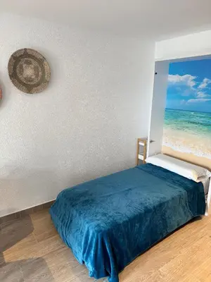 Cama o camas de una habitación en Loft vistes al mar 150 meters Optimist Trophy Esplanade