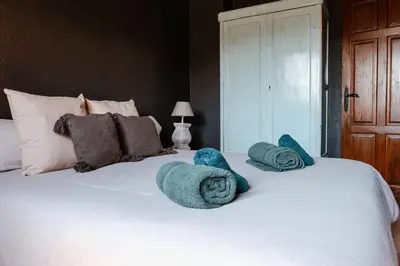 Cama o camas de una habitación en La BERBENA casa rural en el campo