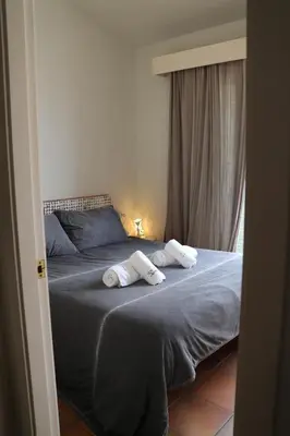 Cama o camas de una habitación en SATUNA BEACH CASA