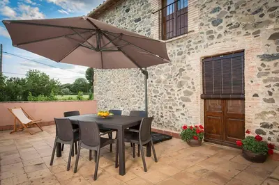 Un patio o zona al aire libre en Casa Rural en Rupià con piscina