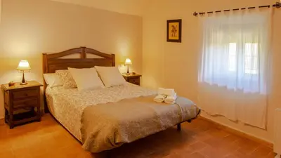 Cama o camas de una habitación en Casa Rural en Rupià con piscina