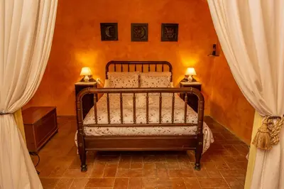 Cama o camas de una habitación en Casa Rural en Rupià con piscina