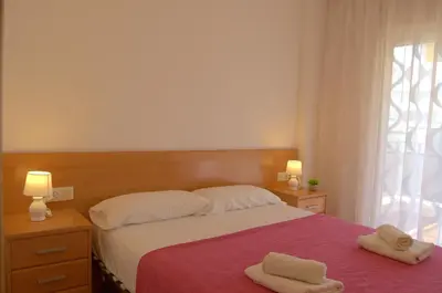 Cama o camas de una habitación en Apartamento Alba a 70 metros de la playa