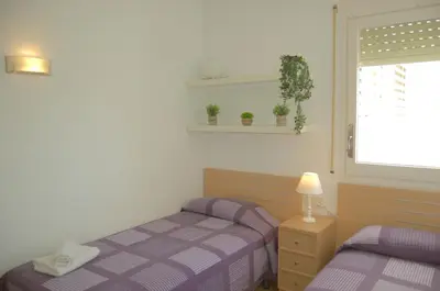 Cama o camas de una habitación en Apartamento Alba a 70 metros de la playa