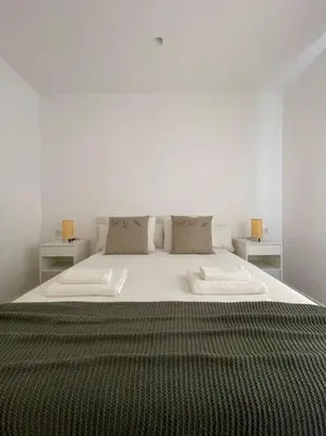 Cama o camas de una habitación en Apartamento nuevo céntrico frente al mar en Palamós