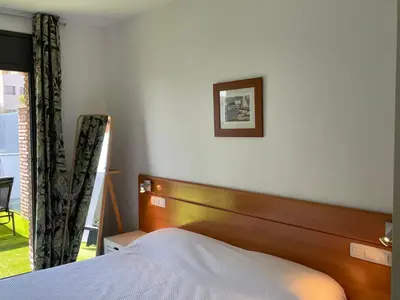 Cama o camas de una habitación en Apartamento renovado cerca de la playa
