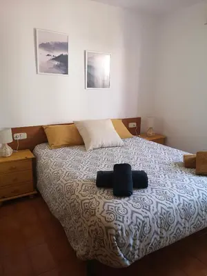 Cama o camas de una habitación en Apartamento con piscina L' Áncora