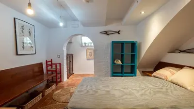 Cama o camas de una habitación en Flateli Sa Tuna Apartment