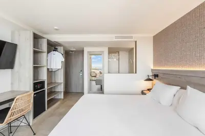 Cama o camas de una habitación en Hotel Metropol