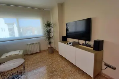 Una televisión o centro de entretenimiento en Atico duplex en Malgrat de Mar