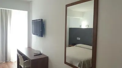 Cama o camas de una habitación en Hotel Astoria Park