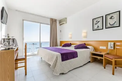 Cama o camas de una habitación en Gran Sol Hotel