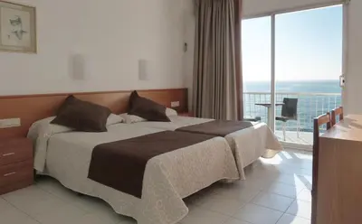 Cama o camas de una habitación en Gran Sol Hotel