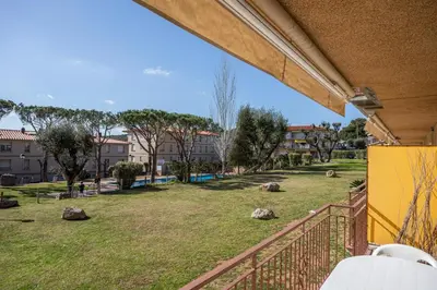 Jardín al aire libre en Apartamentos CASA MAREA La Fosca parking y piscina