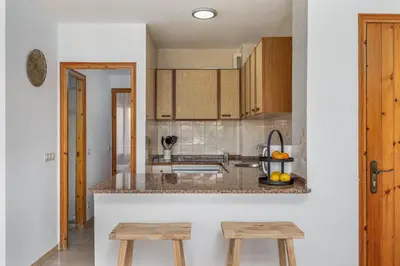 Una cocina o zona de cocina en Apartamentos CASA MAREA La Fosca parking y piscina