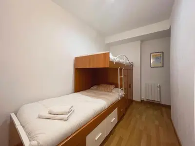Cama o camas de una habitación en Hauzify I Apartament Can Reig