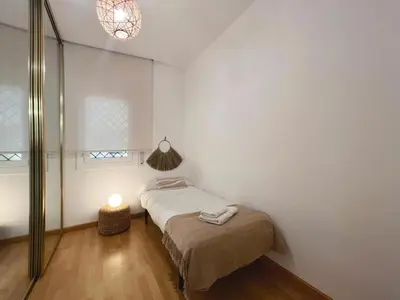 Cama o camas de una habitación en Hauzify I Apartament Can Reig