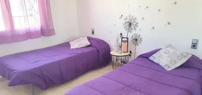 Cama o camas de una habitación en Apartamento acogedor cerca de la playa y puerto.