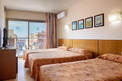 Cama o camas de una habitación en htop Palm Beach & SPA #htopEnjoy