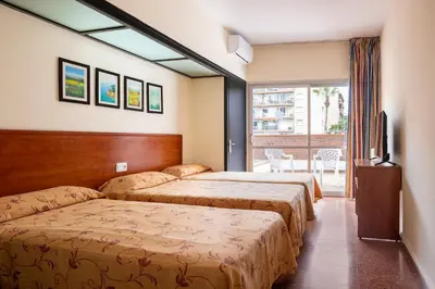 Cama o camas de una habitación en htop Palm Beach & SPA #htopEnjoy