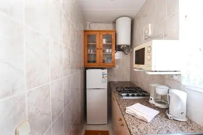 Una cocina o zona de cocina en Apartamento con piscina en S'agaró