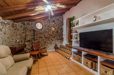 Una televisión o centro de entretenimiento en Club Villamar - Masia Can Vilar