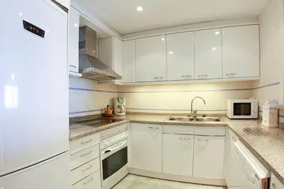 Una cocina o zona de cocina en Club Villamar - Apartment Amatella