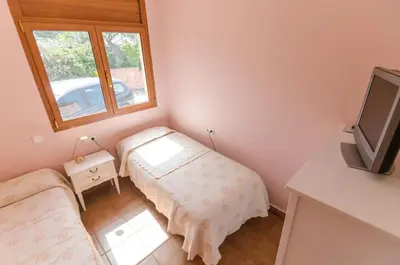 Cama o camas de una habitación en Club Villamar - Ayarza