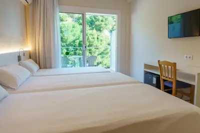 Cama o camas de una habitación en Checkin Catalonia