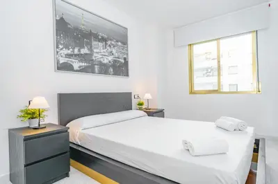 Cama o camas de una habitación en HomeHolidaysRentals Cyan- Costa Barcelona