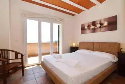 Cama o camas de una habitación en Club Villamar - Cala Llevado 40