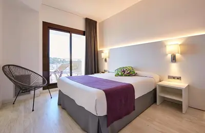 Cama o camas de una habitación en Hotel Samba