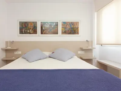 Cama o camas de una habitación en LETS HOLIDAYS APARTMENT SEA VIEWS on the BEACH