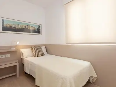 Cama o camas de una habitación en LETS HOLIDAYS APARTMENT SEA VIEWS on the BEACH