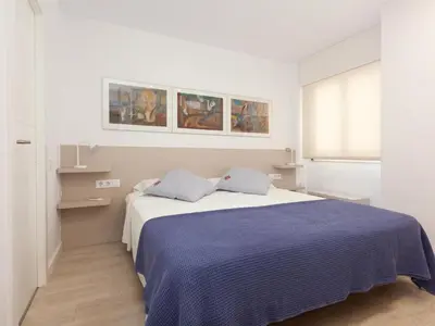 Cama o camas de una habitación en LETS HOLIDAYS APARTMENT SEA VIEWS on the BEACH