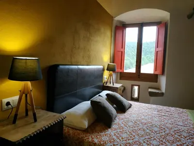 Cama o camas de una habitación en Mas Can Puig de Fuirosos ONLY ADULTS