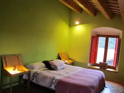 Cama o camas de una habitación en Mas Can Puig de Fuirosos ONLY ADULTS