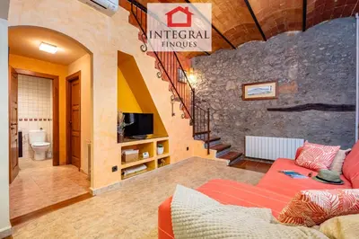 Una televisión o centro de entretenimiento en Home Holiday Palamós