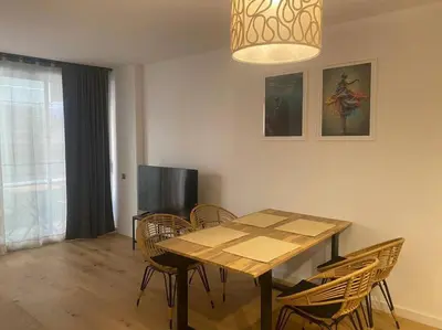 Una televisión o centro de entretenimiento en Piso LUJO de la Playa Lloret.