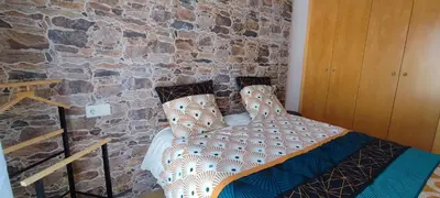 Cama o camas de una habitación en LLOGUER30 Mamour, cómodo y familiar