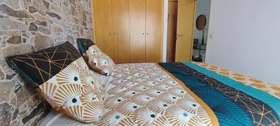 Cama o camas de una habitación en LLOGUER30 Mamour, cómodo y familiar