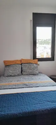 Cama o camas de una habitación en LLOGUER30 Mamour, cómodo y familiar