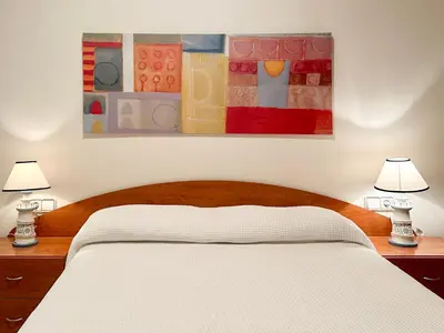 Cama o camas de una habitación en LETS HOLIDAYS CENTRIC APARTMENT with POOL in TOSSA 2