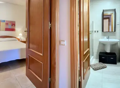 Cama o camas de una habitación en LETS HOLIDAYS CENTRIC APARTMENT with POOL in TOSSA 2