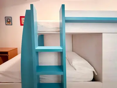 Cama o camas de una habitación en LETS HOLIDAYS CENTRIC APARTMENT with POOL in TOSSA 2