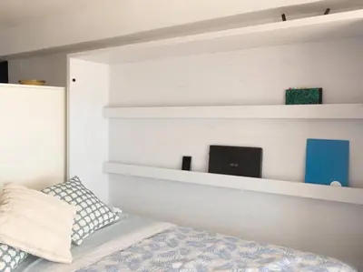 Cama o camas de una habitación en Estudio con vistas increíbles al mar