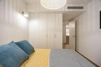 Cama o camas de una habitación en Gran piso en Puerto deportivo Marina Palamós IDEAL FAMILIAS